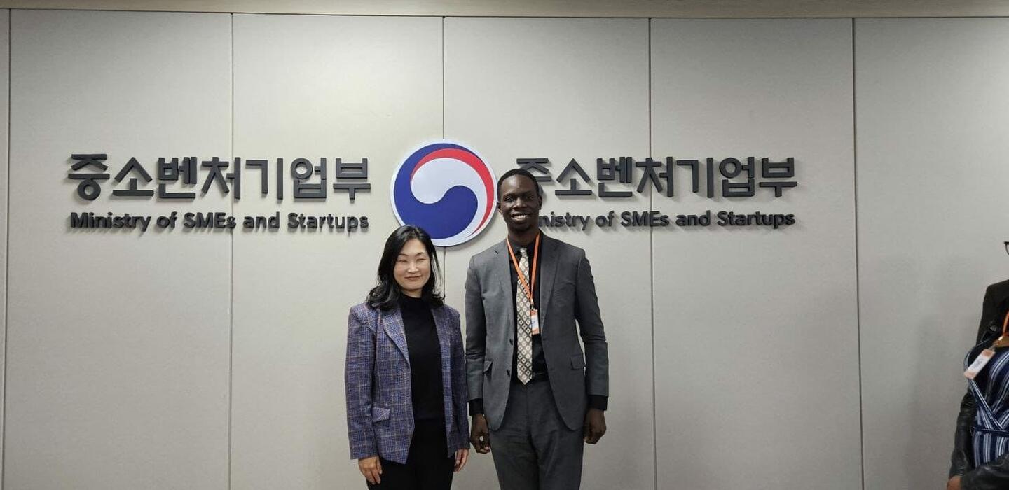 Ugandan parliamentarian Boniface Okot stands next to Sumin Park, Director for the International Cooperation Division at the Ministry of SMEs and Startups