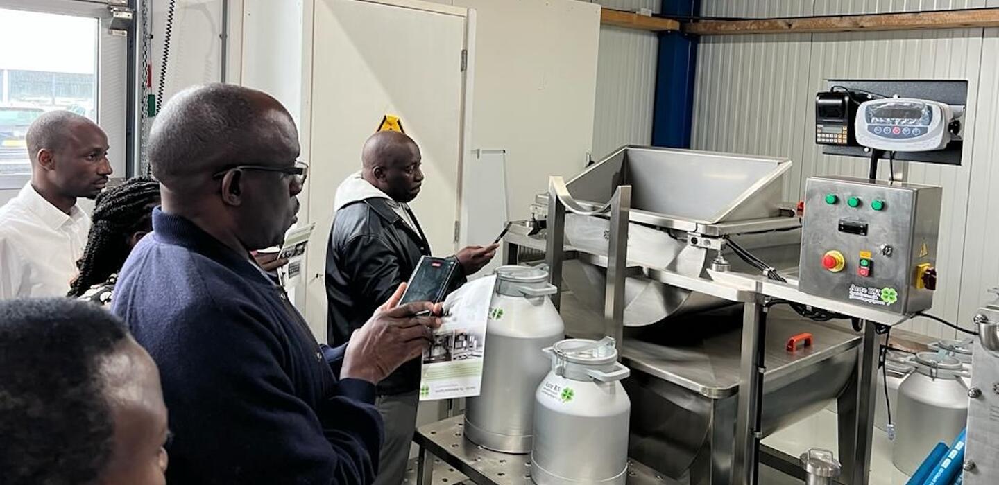 Ugandan entrepreneurs take photos of farm equipment in the Netherlands