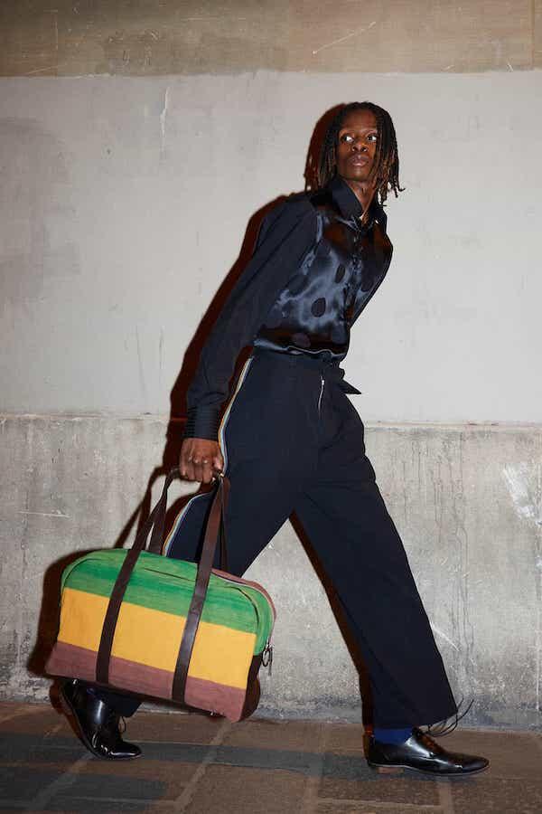Male model with bag, wearing African fashion