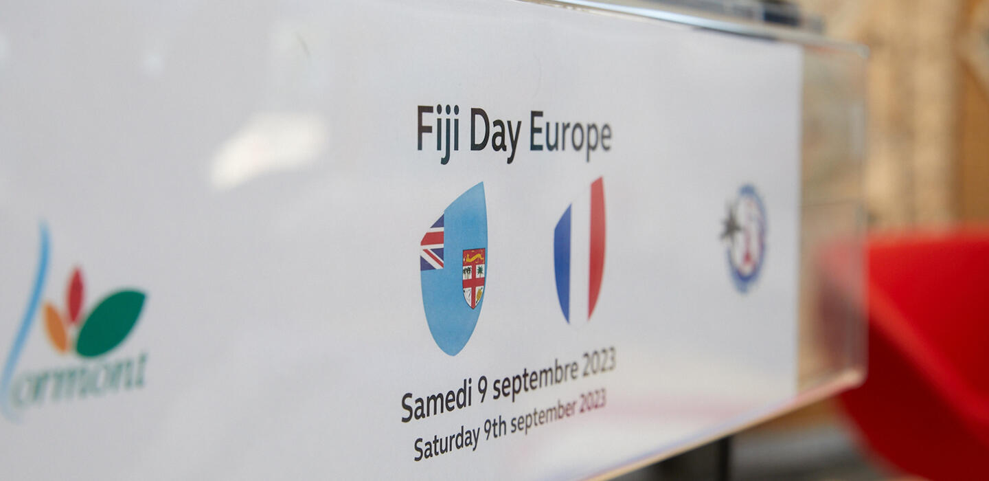 Sign announces Fiji Day Europe 2023 with images of France and Fiji flags