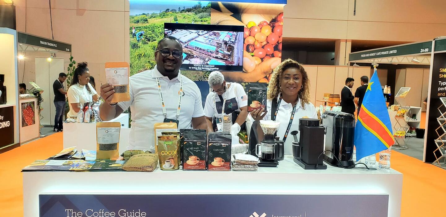 Two African coffee producers display their coffee at trade show